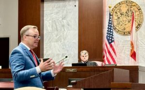 Prosecutor Zachary Taylor, above, makes his case to jurors. Defendant Bobby Allen is watched closely by BCSO Bailiff Riner.